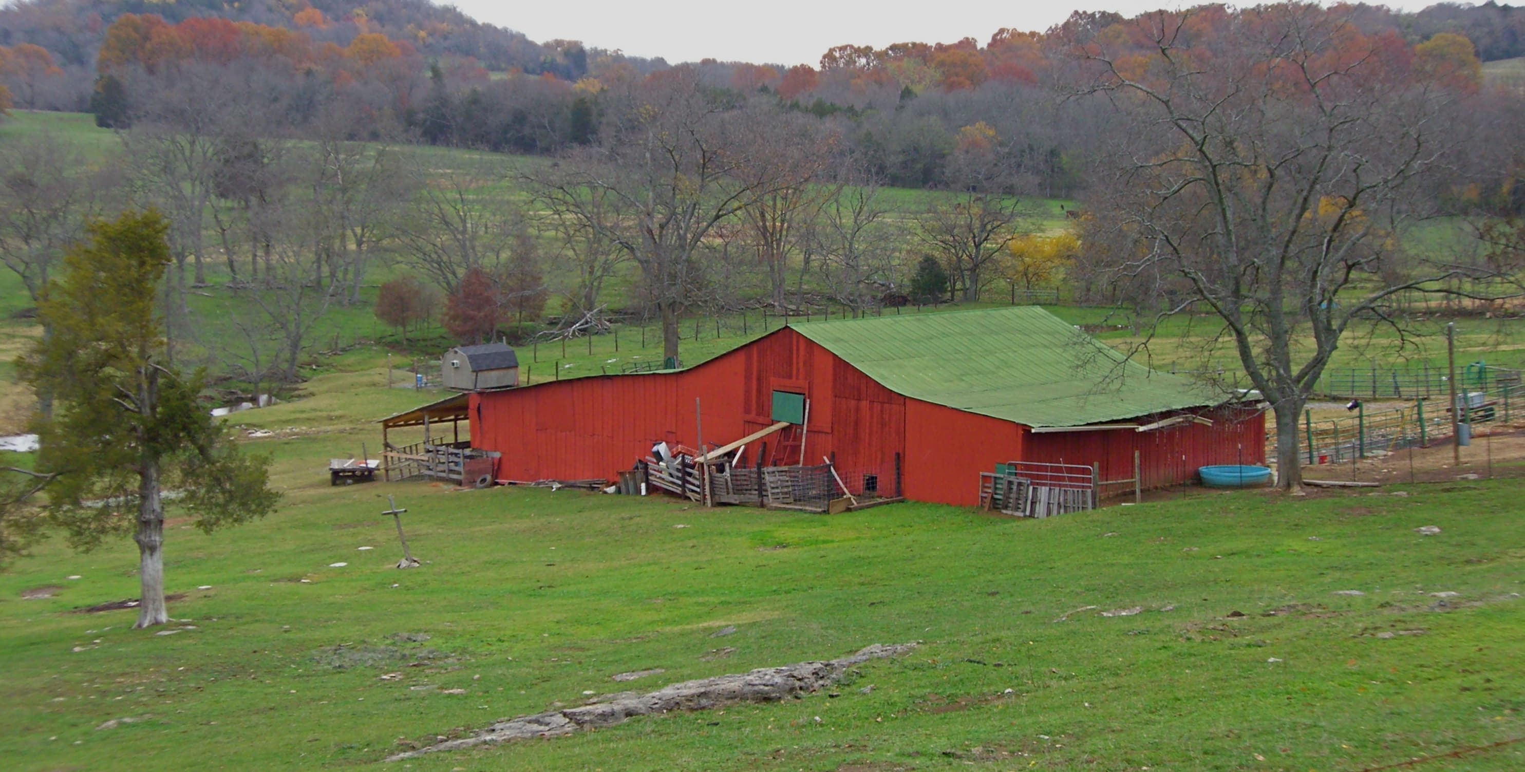 Red barn on rolling green pasture in Williamson County, Tennessee