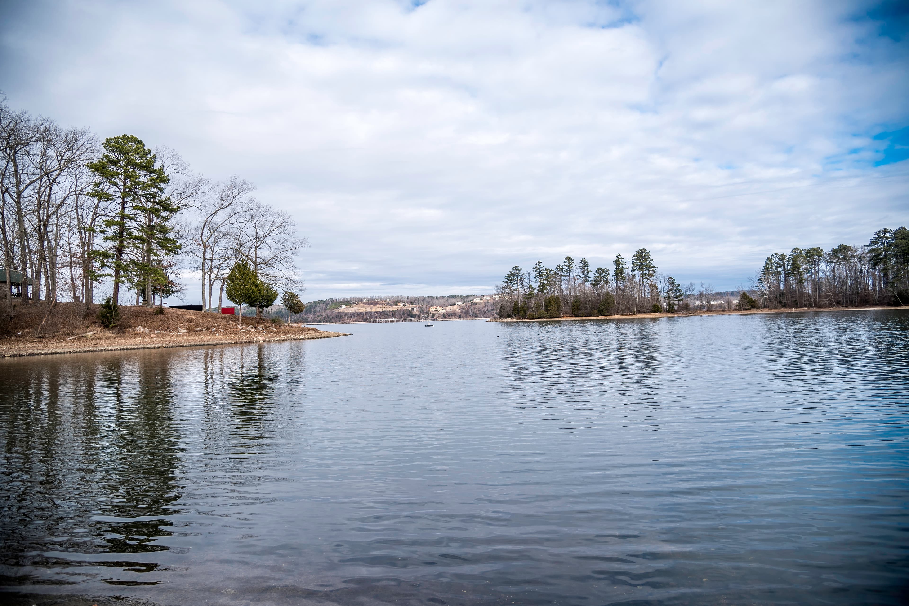 Scenic view of Pickwick Lake in Hardin County, Tennessee with clouds reflected on calm water